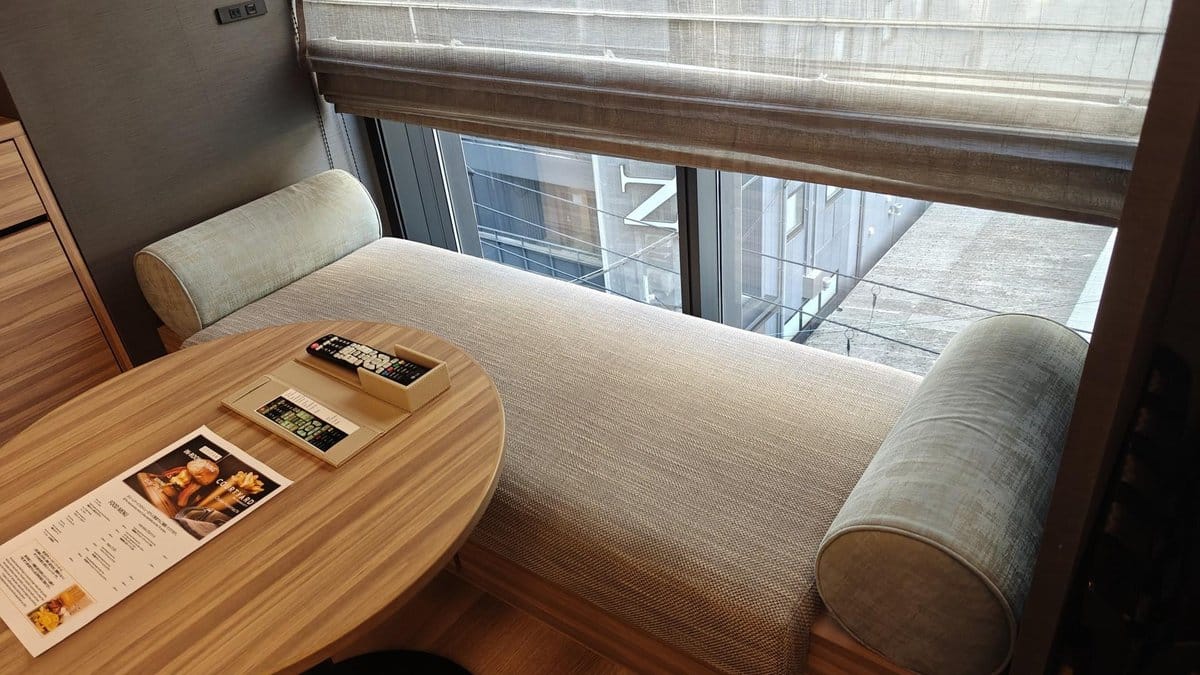 Cozy daybed by large city window