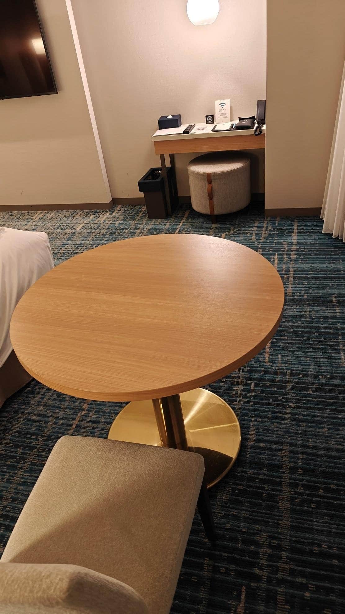 Cozy hotel room with desk and table