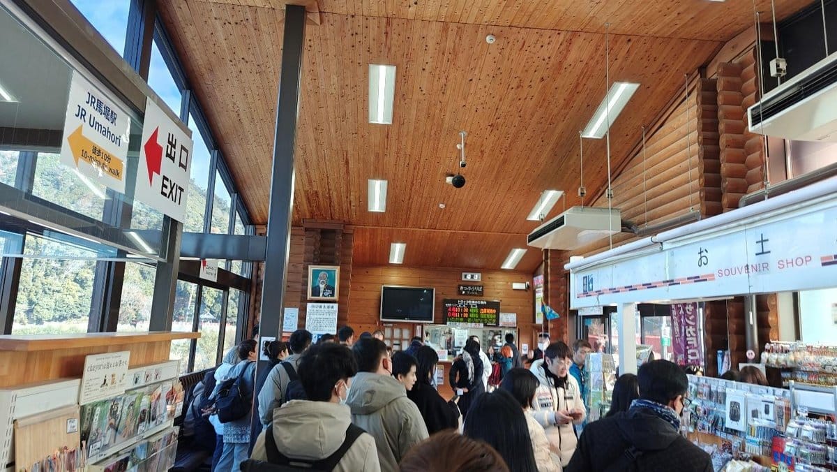 Crowded souvenir shop in a wooden interior station