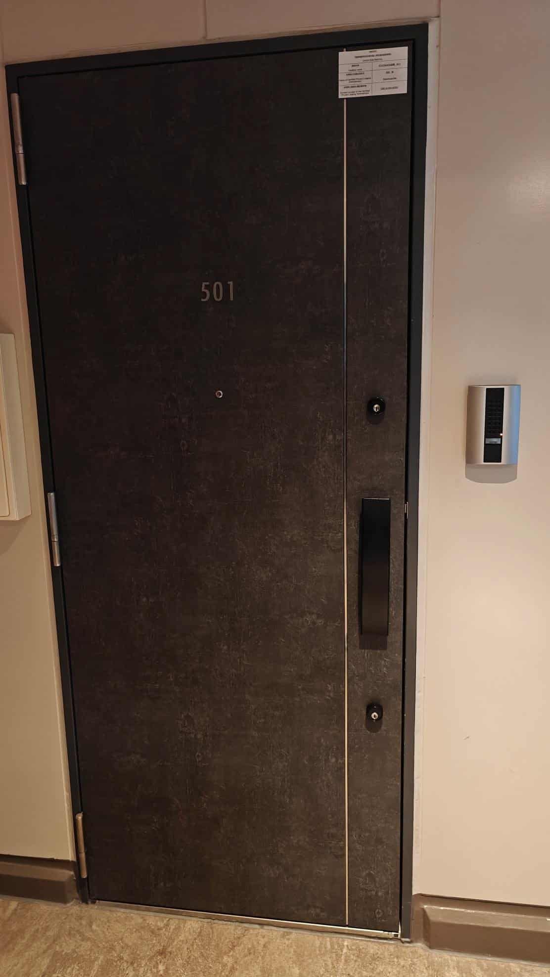 Dark apartment door with keypad
