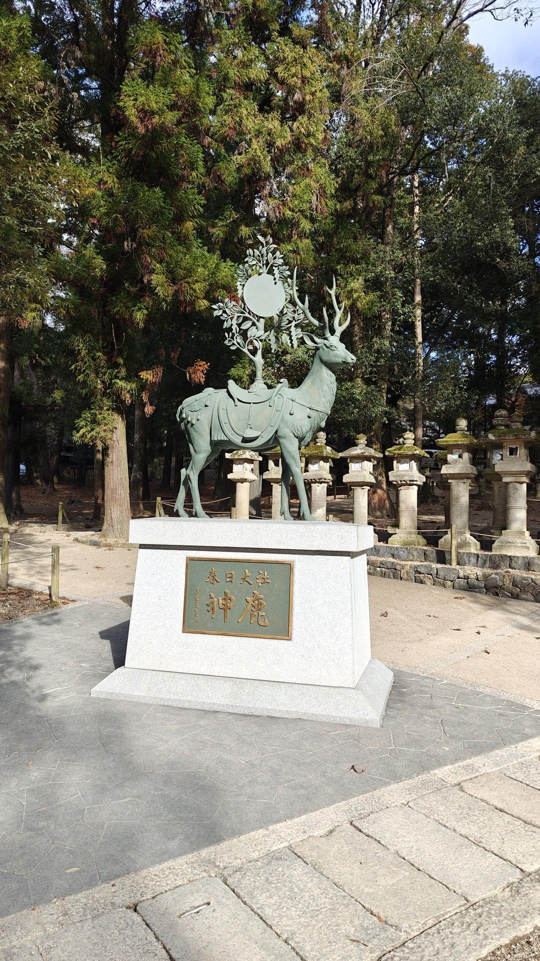 Deer statue in a forest setting