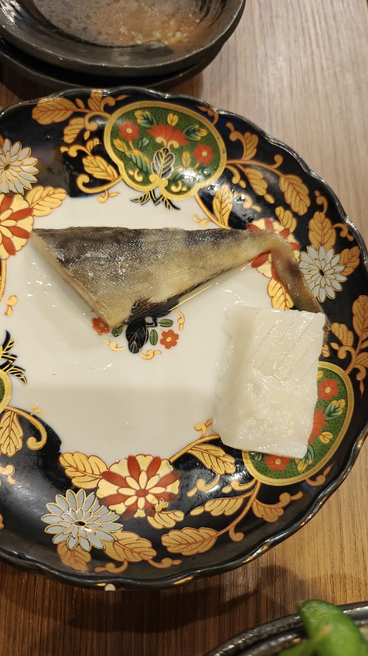 Fish and tofu on ornate plate