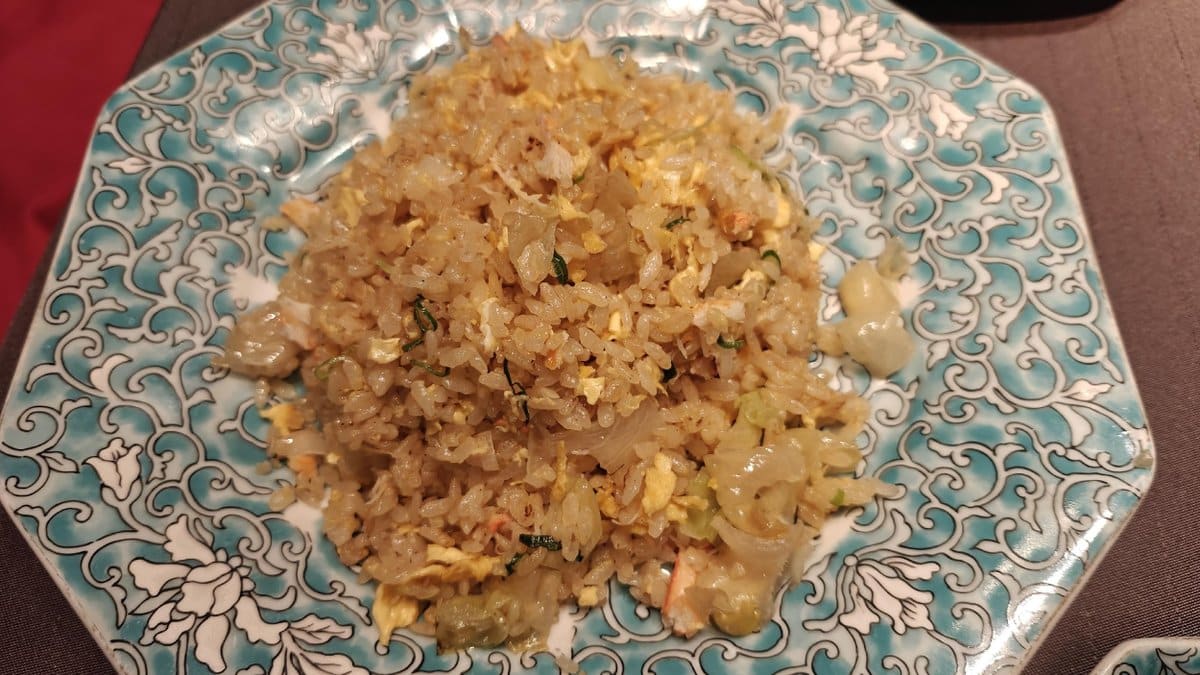 Fried rice on ornate blue plate