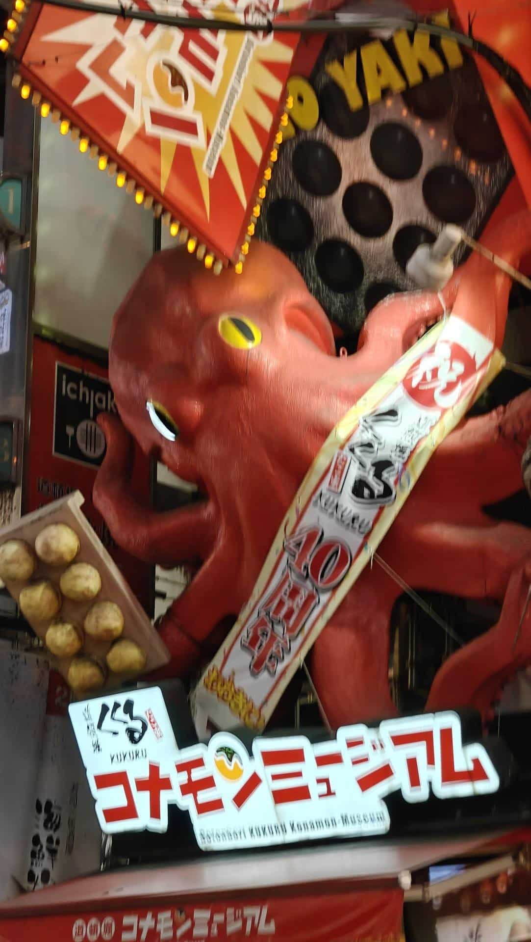 Giant red octopus and takoyaki display