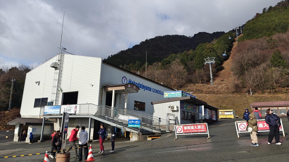 Gondola station with mountain backdrop