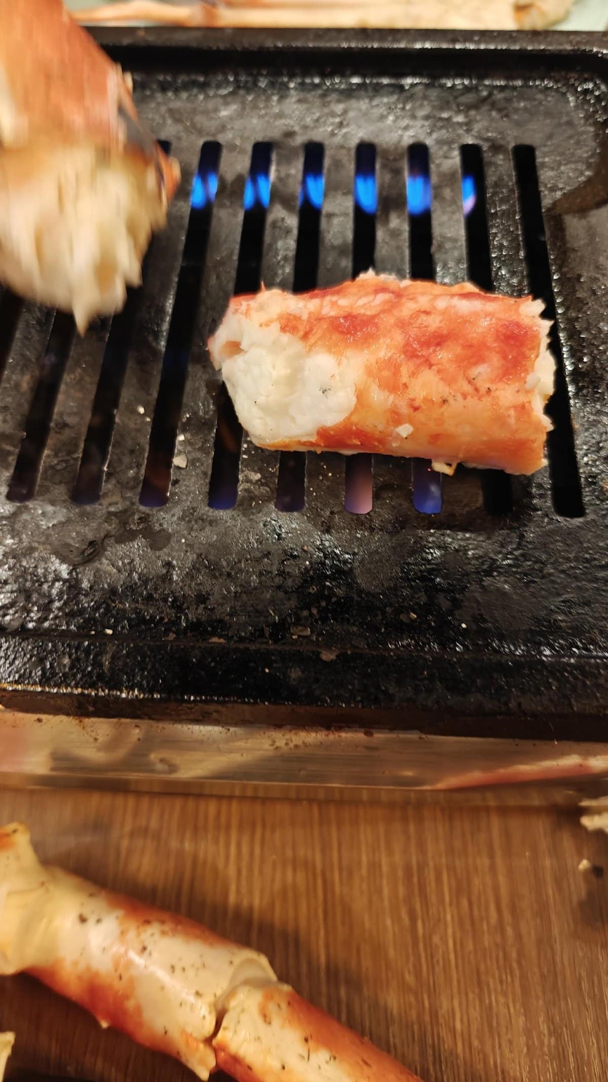 Grilling crab on an open flame