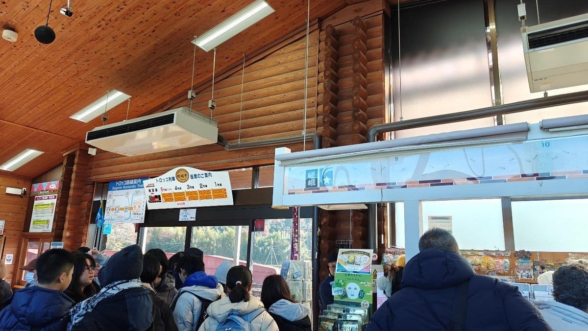 Group of people in a wooden interior store with signs