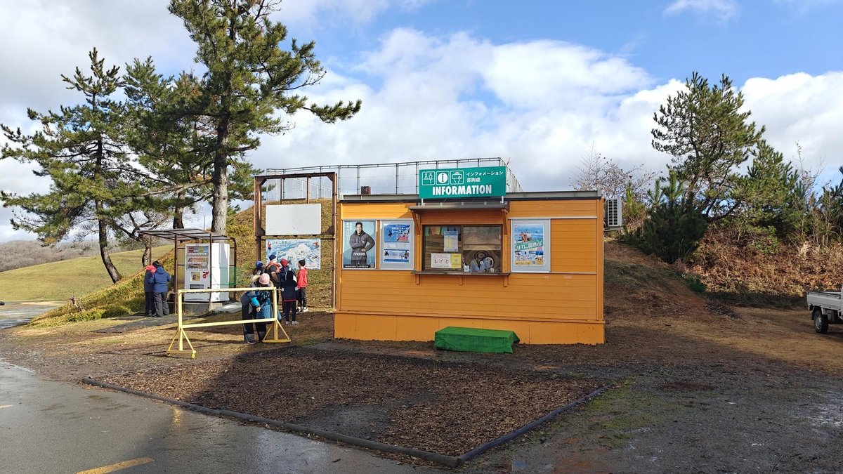Information booth near pine trees