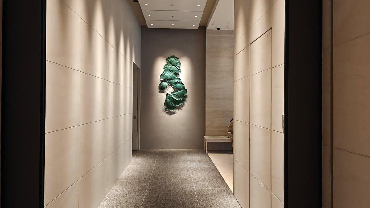 Modern hallway with leaf wall art