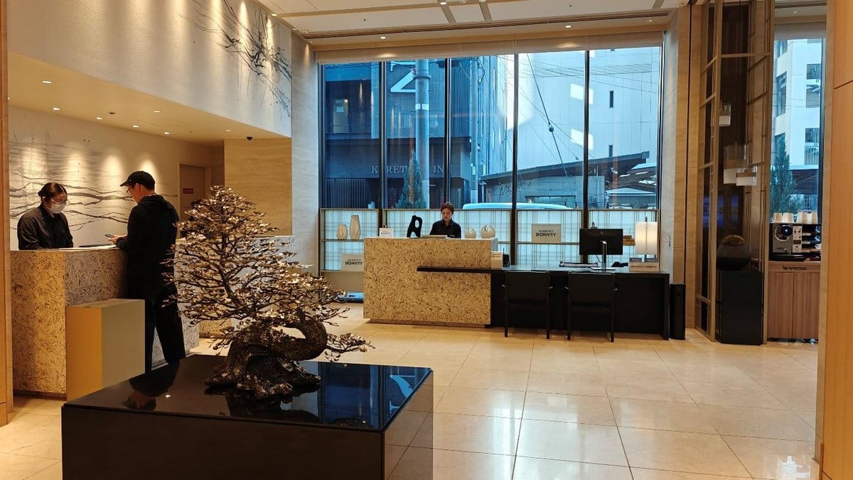 Modern hotel lobby with reception desks