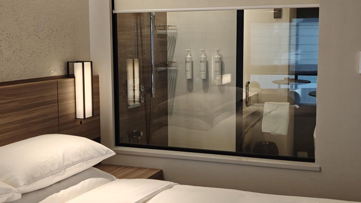 Modern hotel room with glass shower