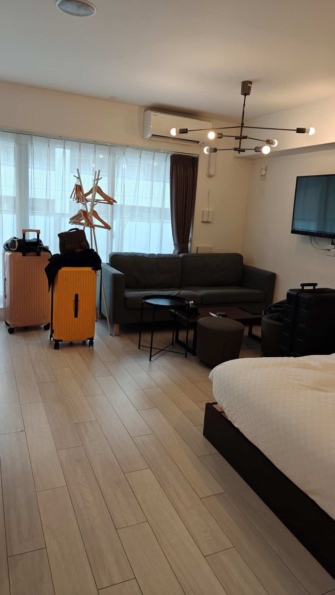 Modern hotel room with luggage