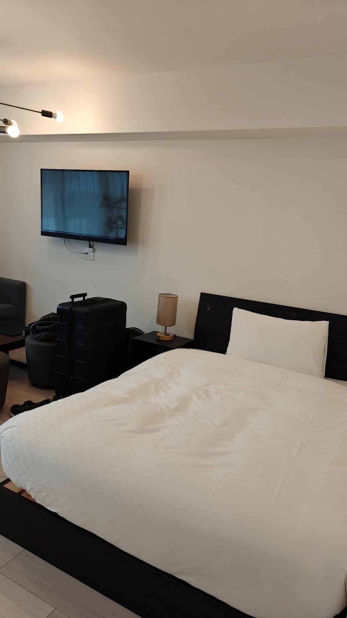 Modern hotel room with neat bed