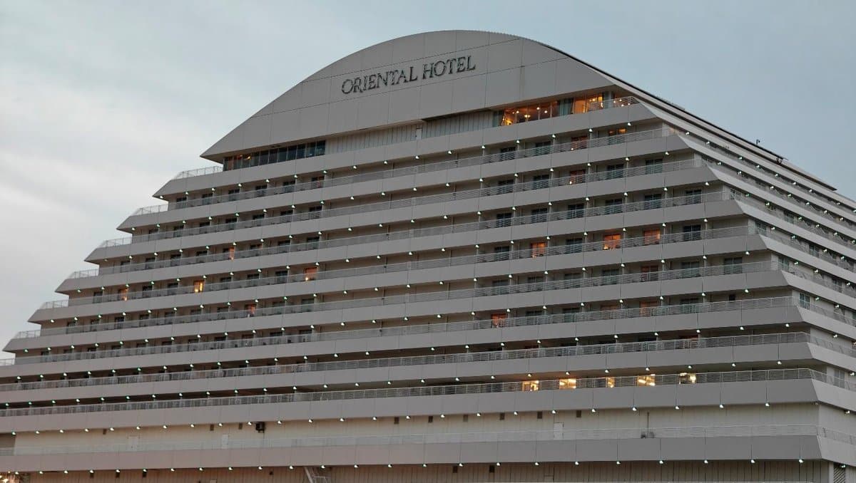 Modern hotel with lights at dusk