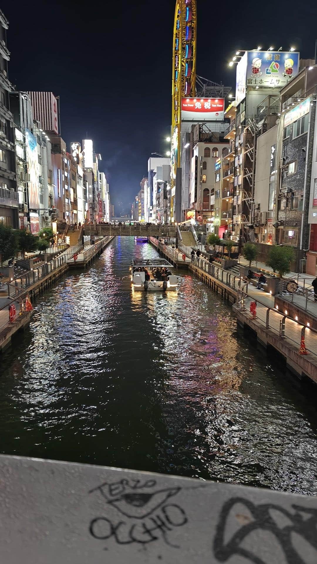 Night canal with illuminated boat