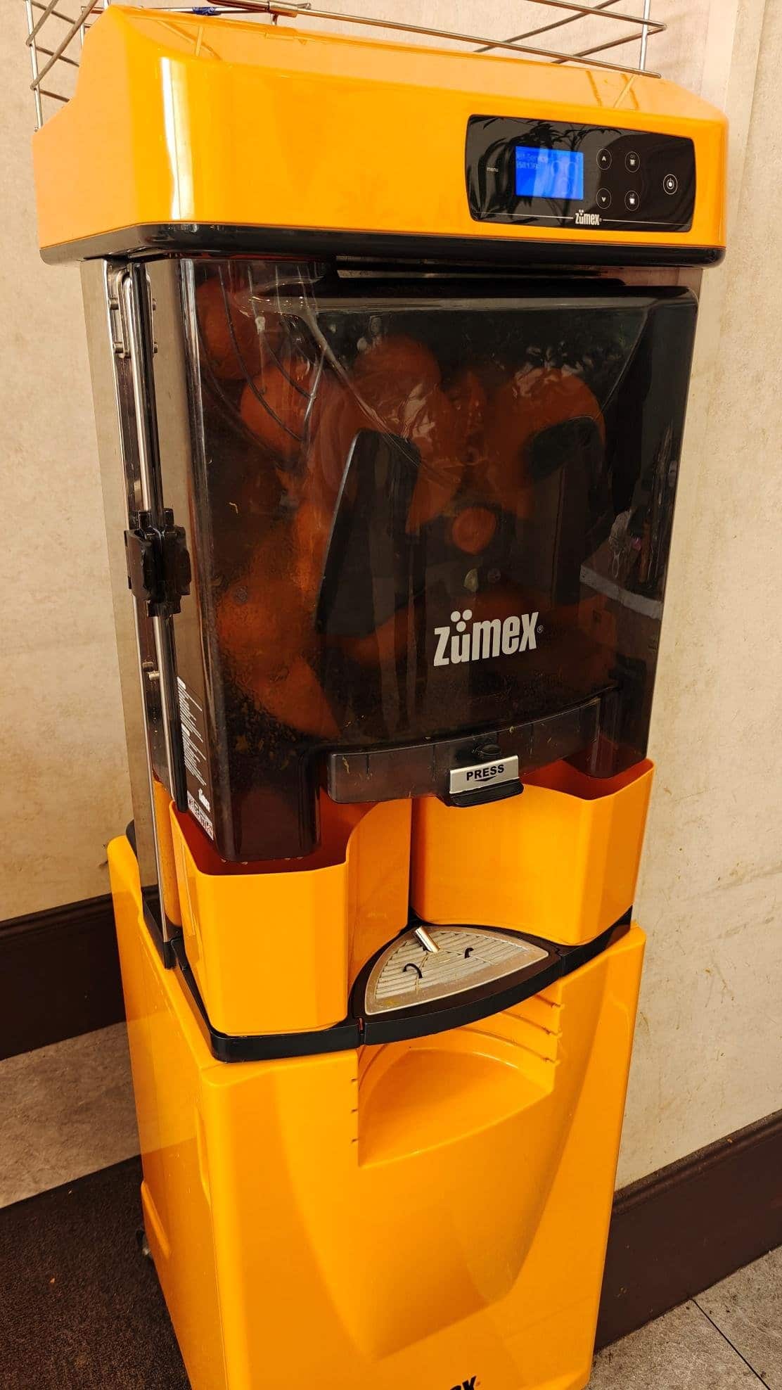 Orange juice machine in cafeteria