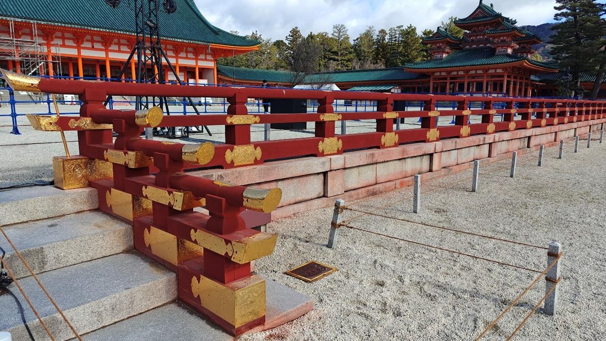 Ornate red and gold railing at a traditional Japanese shrine