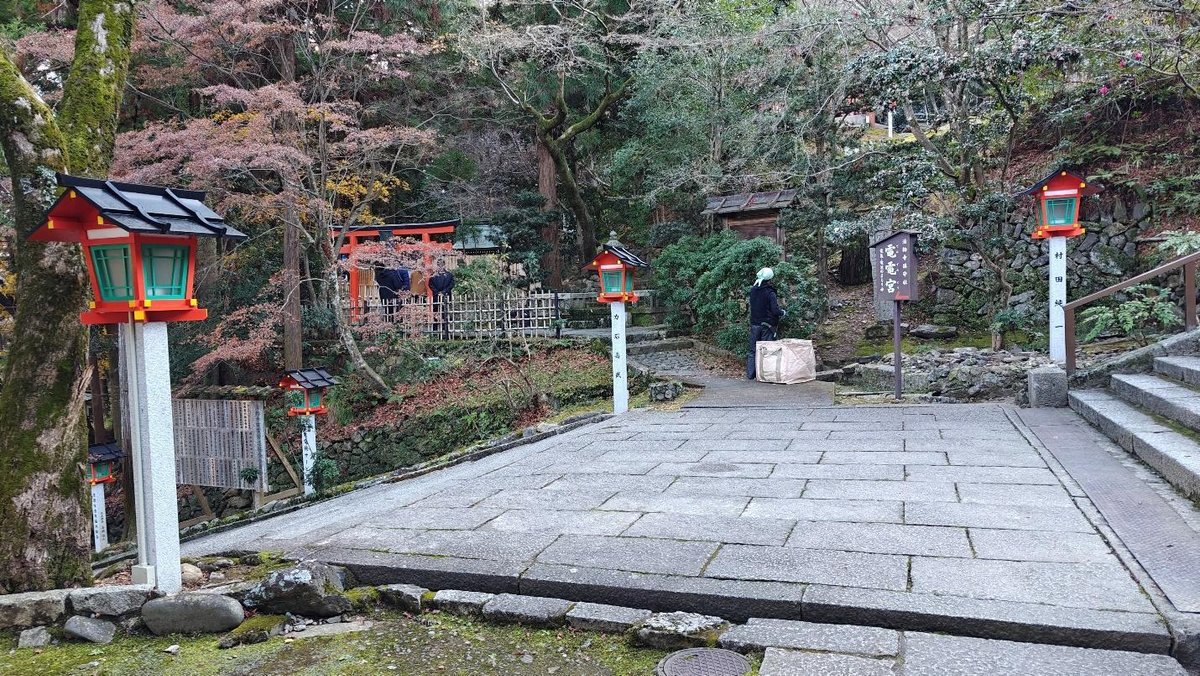 Pathway with red lanterns and autumn trees in serene garden