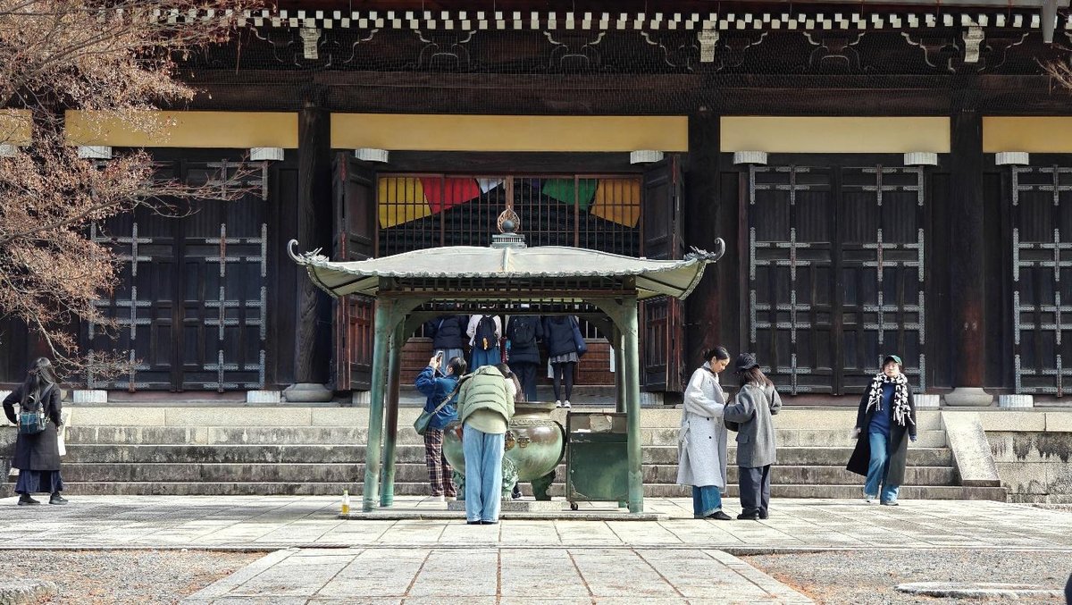 People at a traditional temple with colorful drapes