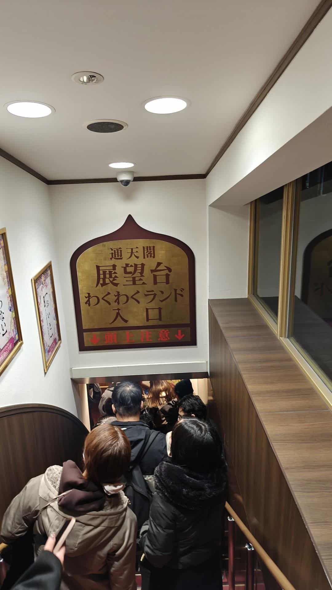 People descending crowded staircase