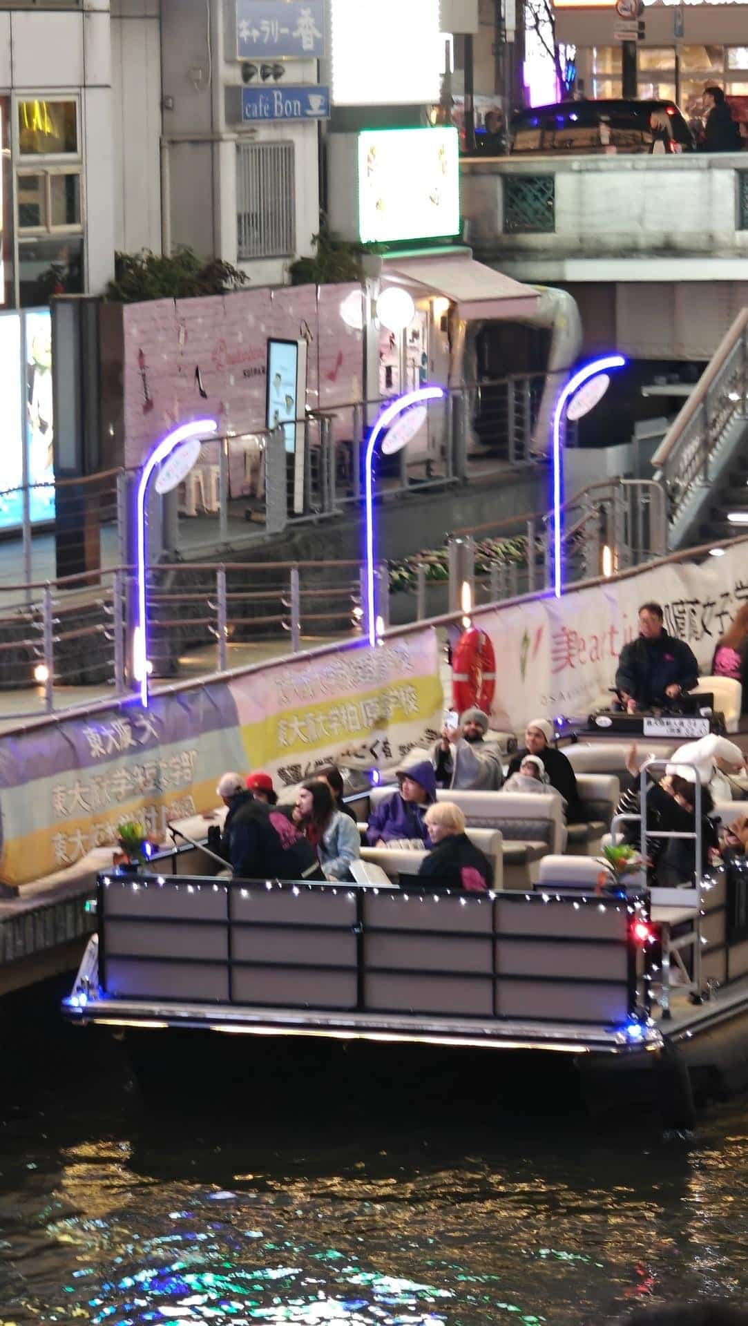People on illuminated canal boat ride