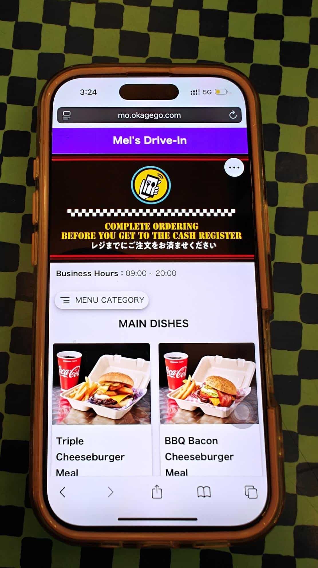 Phone displaying burger menu webpage