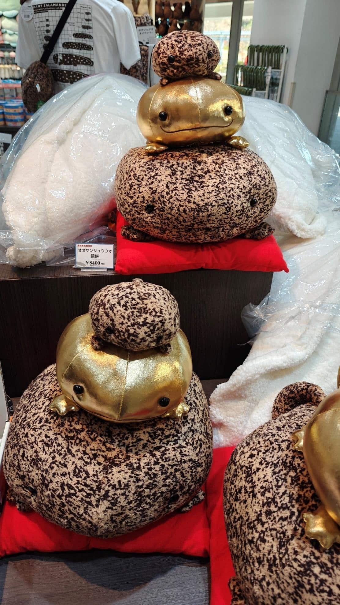 Plush golden and speckled salamanders on display