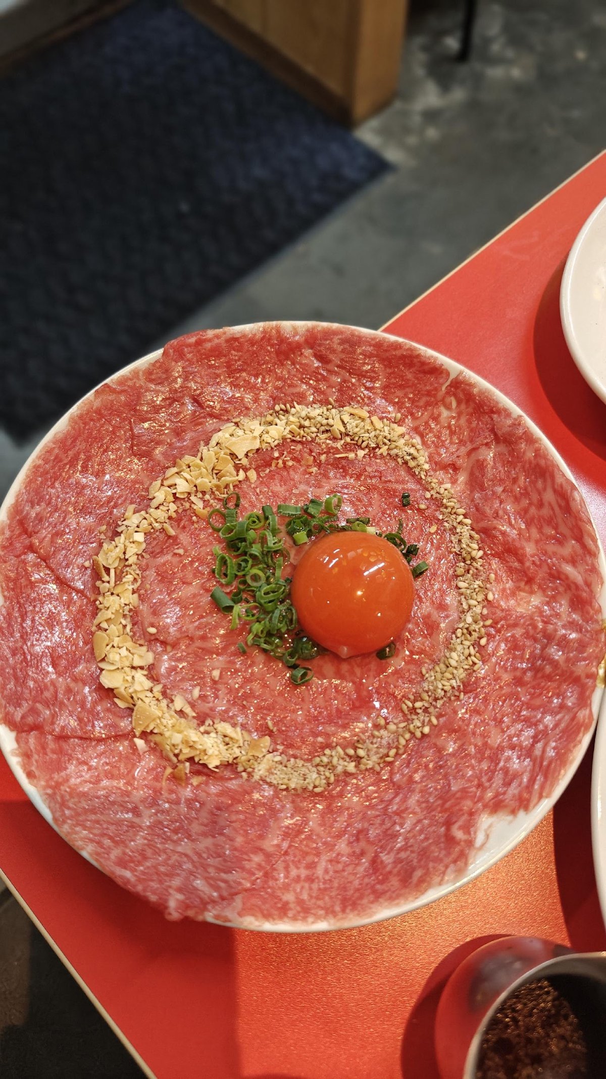 Raw beef with egg yolk and peanuts