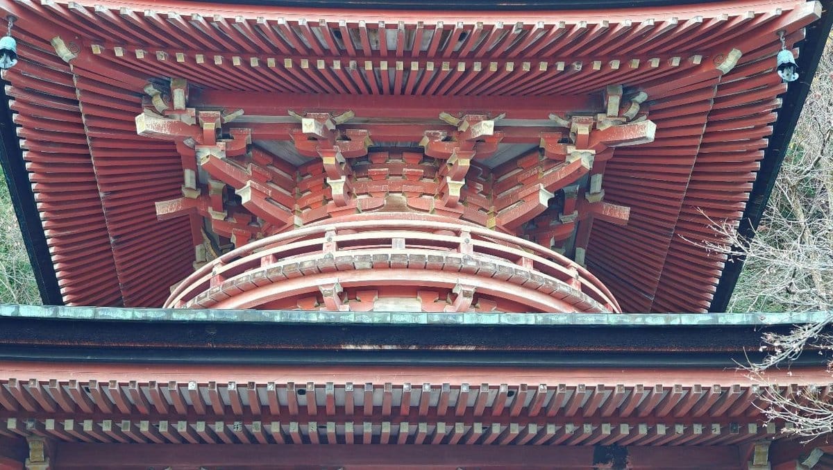 Red pagoda roof with intricate wooden details