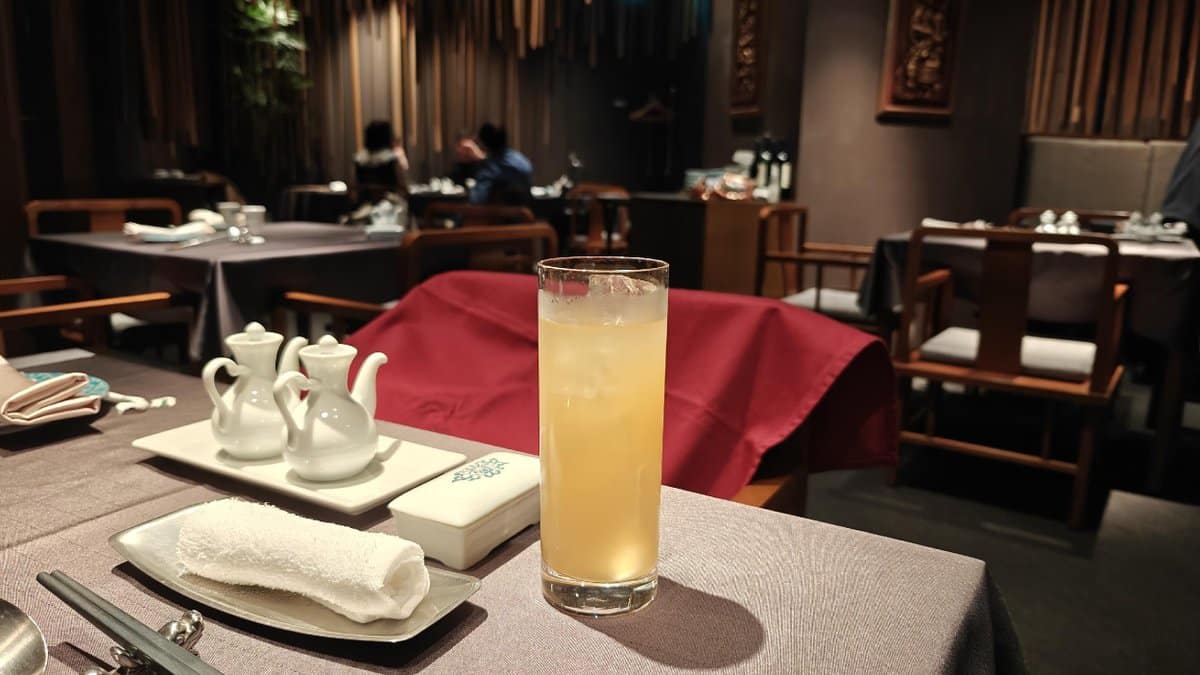Restaurant table with drink and teapots