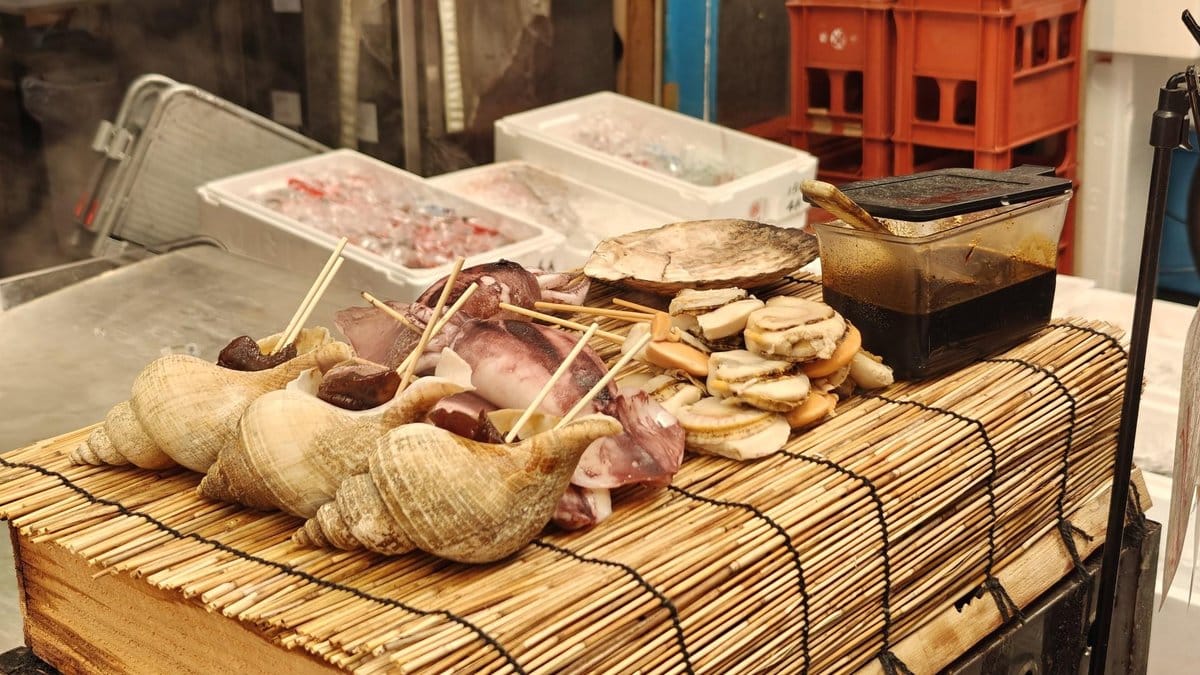 Seafood skewers on bamboo mat