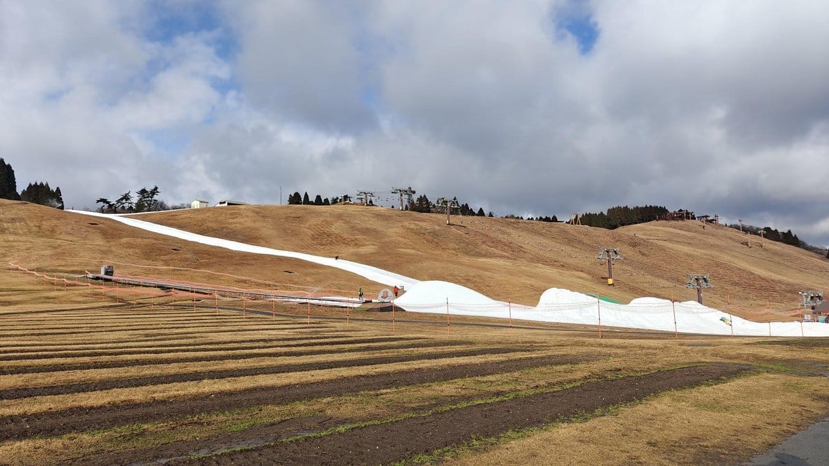 Ski slope with snow and cable cars