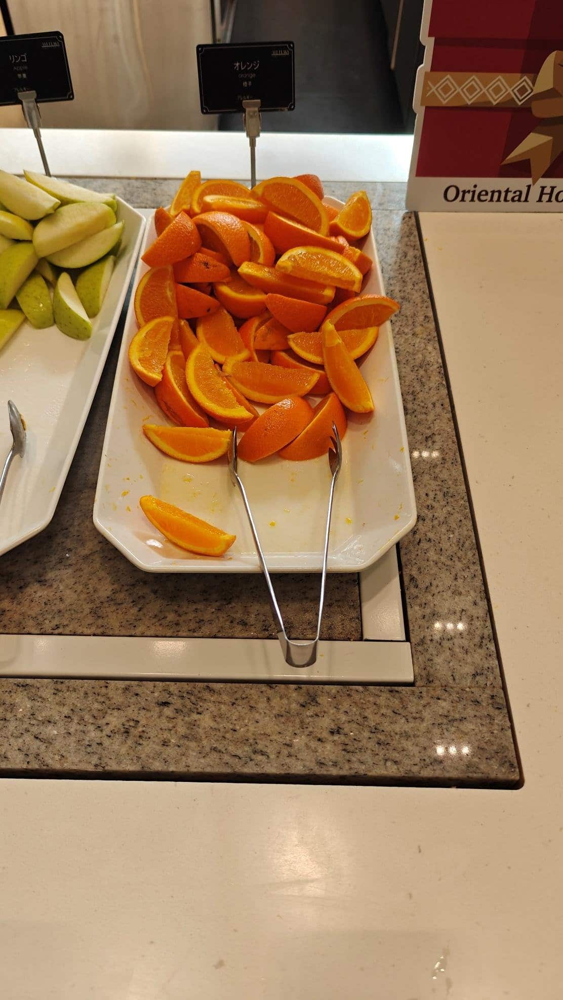 Sliced oranges on buffet tray