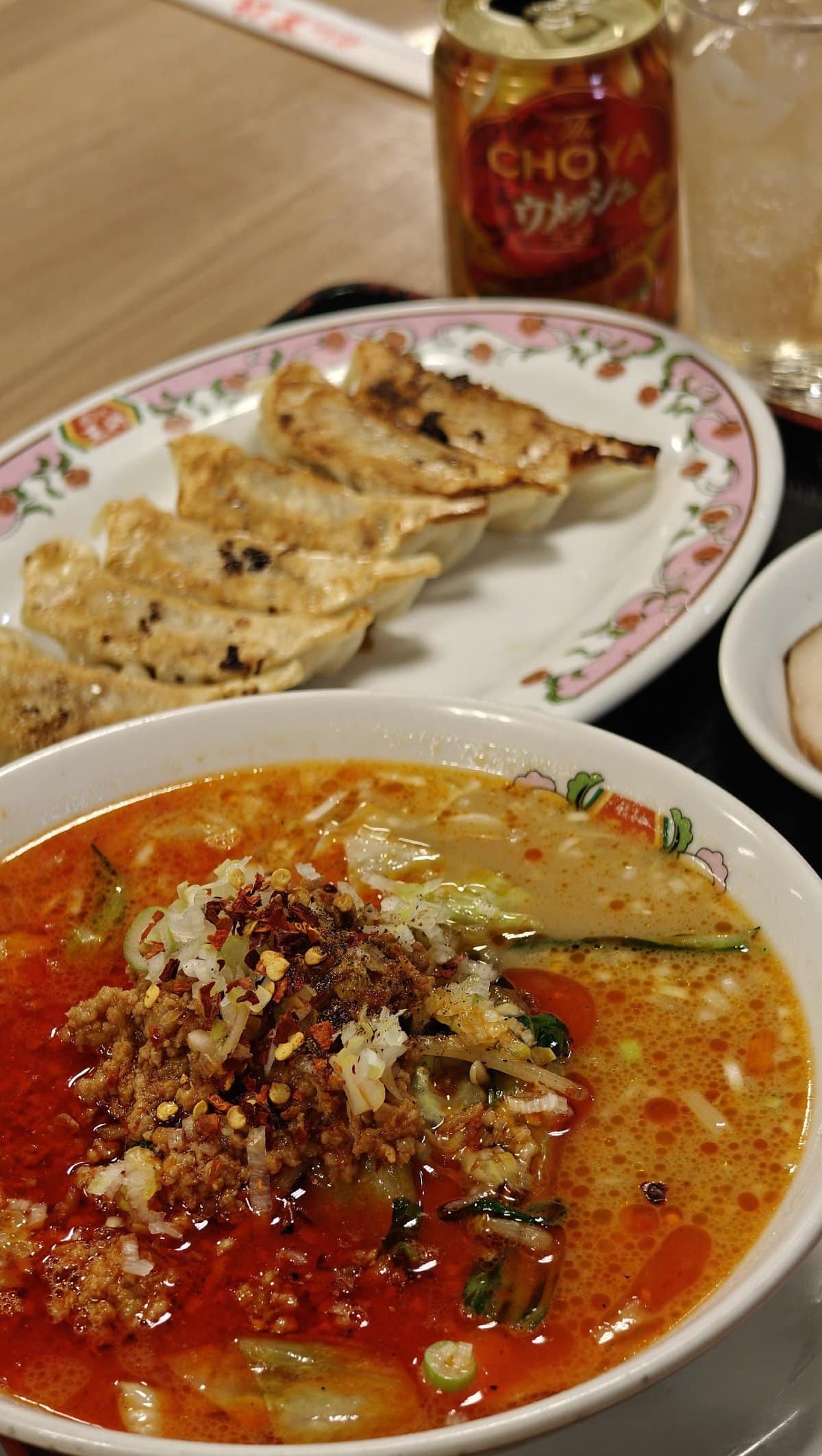 Spicy ramen with gyoza and drink