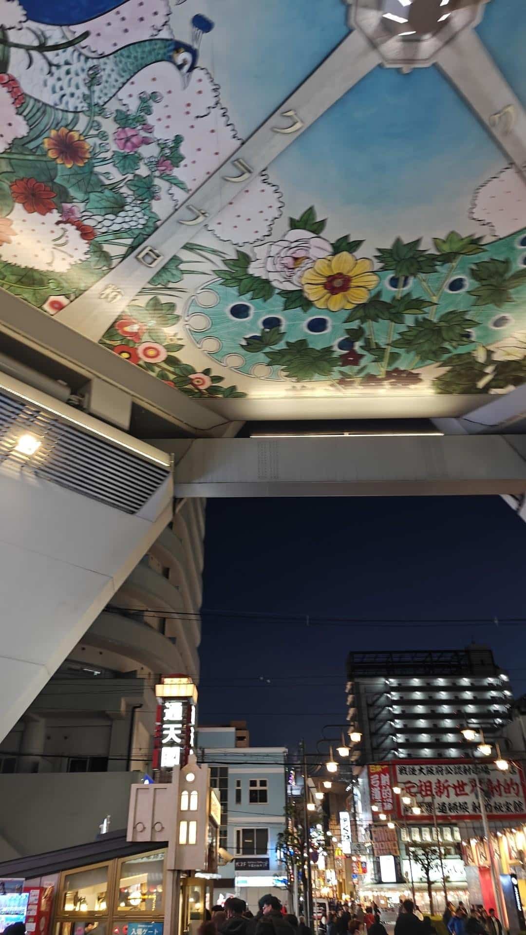Street scene under floral ceiling art