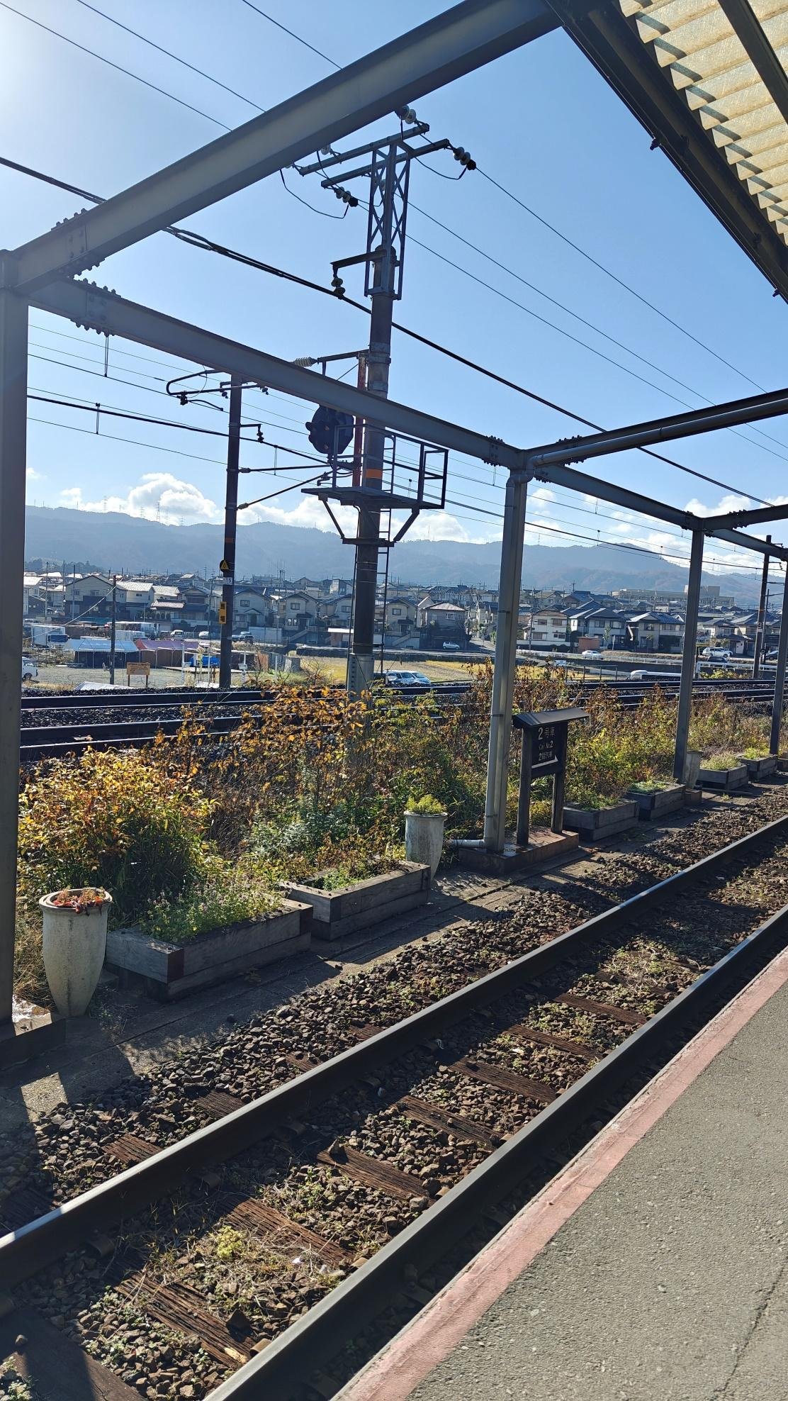 Sunny railway station with mountain view
