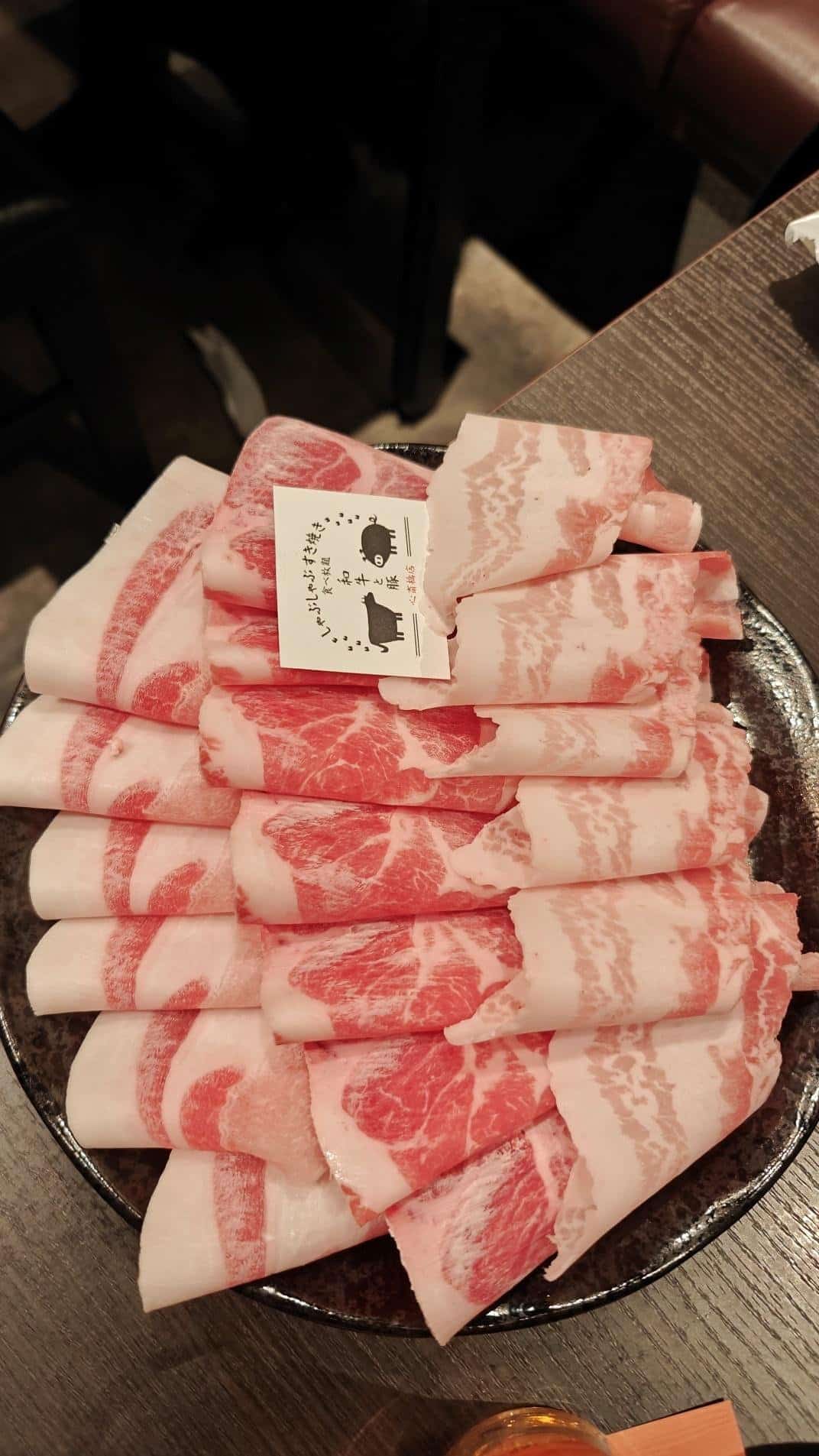 Thinly sliced marbled meat arranged neatly