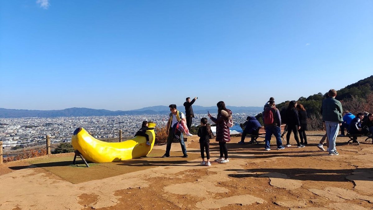 Tourists at scenic hilltop viewpoint