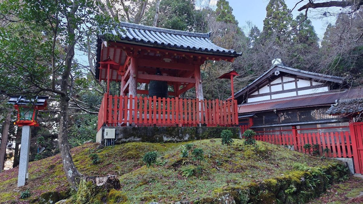 Traditional Japanese shrine in a forest setting