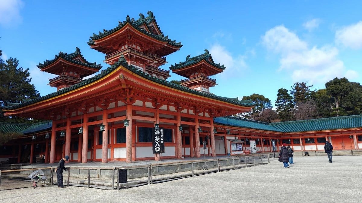 Traditional Japanese temple with ornate green and orange roof