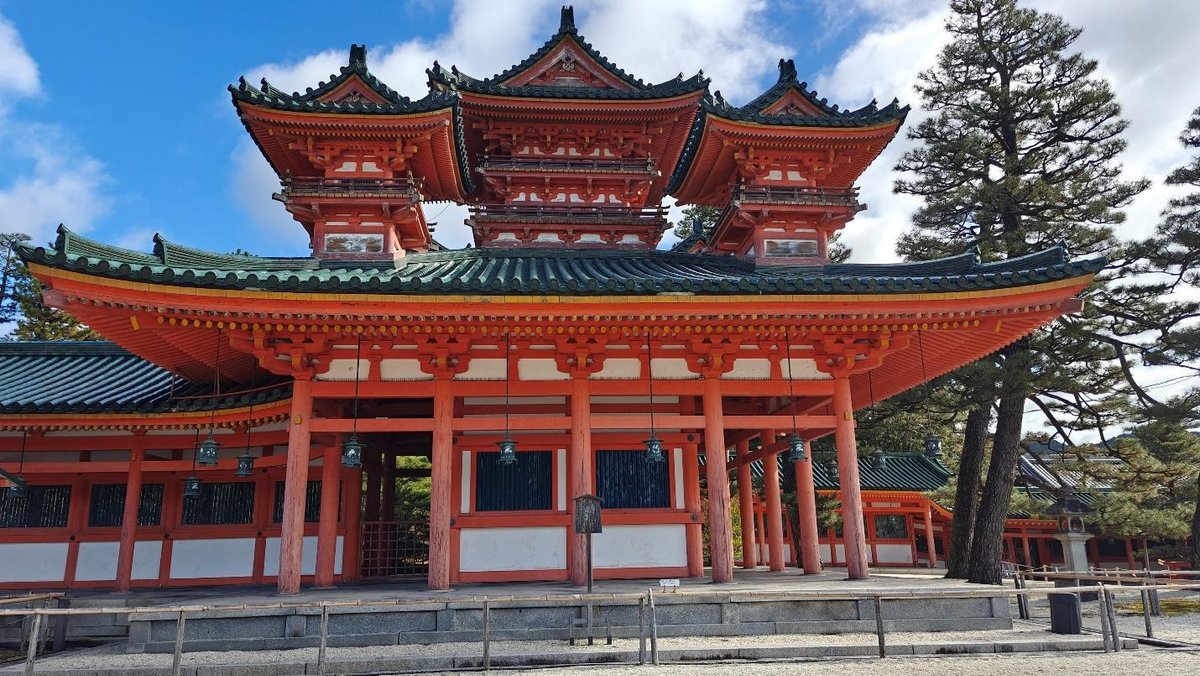 Traditional Japanese temple with ornate red and green roof