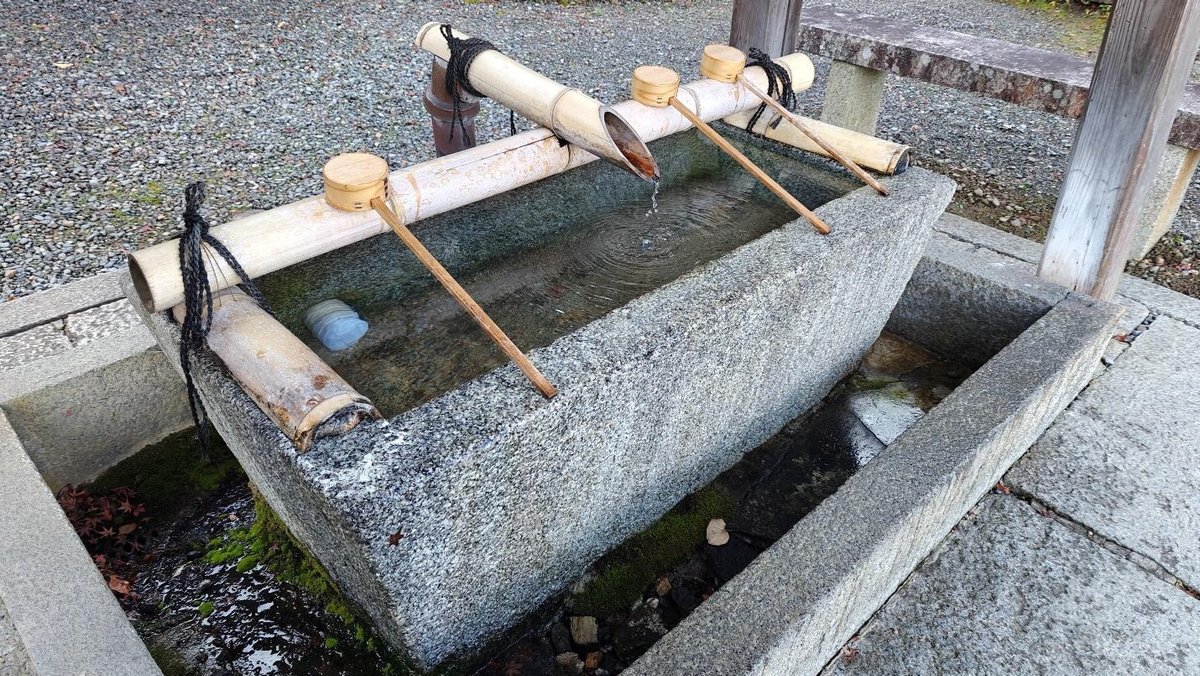 Traditional Japanese water basin with bamboo ladles