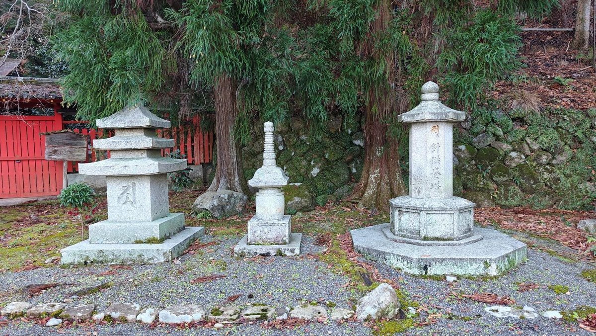 Traditional stone lanterns in a tranquil forest setting