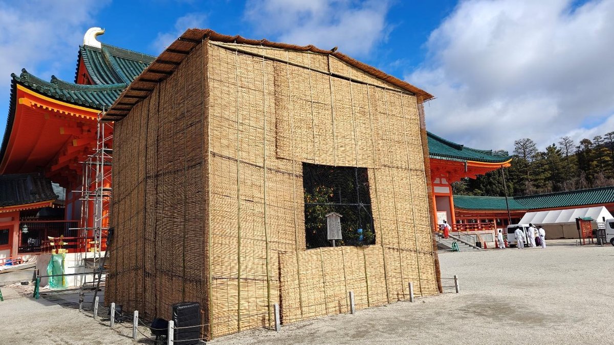 Traditional temple with bamboo structure under blue sky