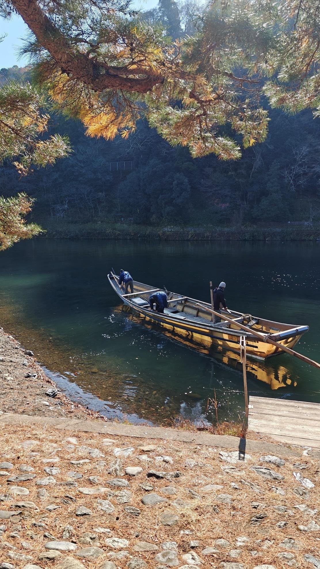 Traditional wooden boat on calm forest river