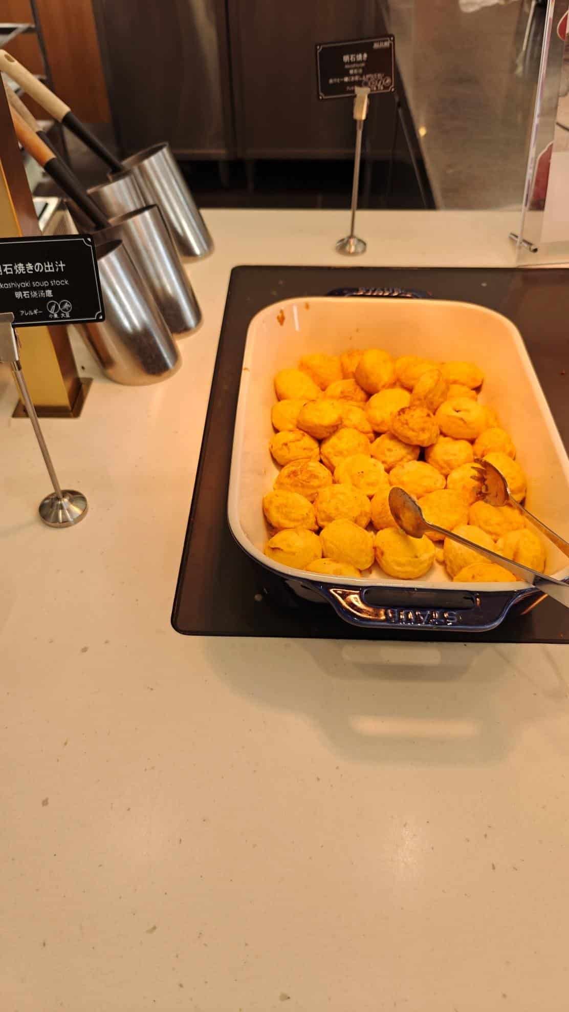 Tray of golden takoyaki balls