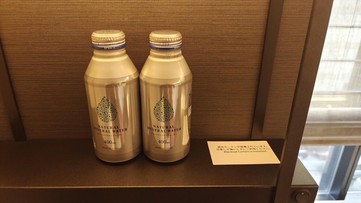 Two bottles of mineral water on shelf