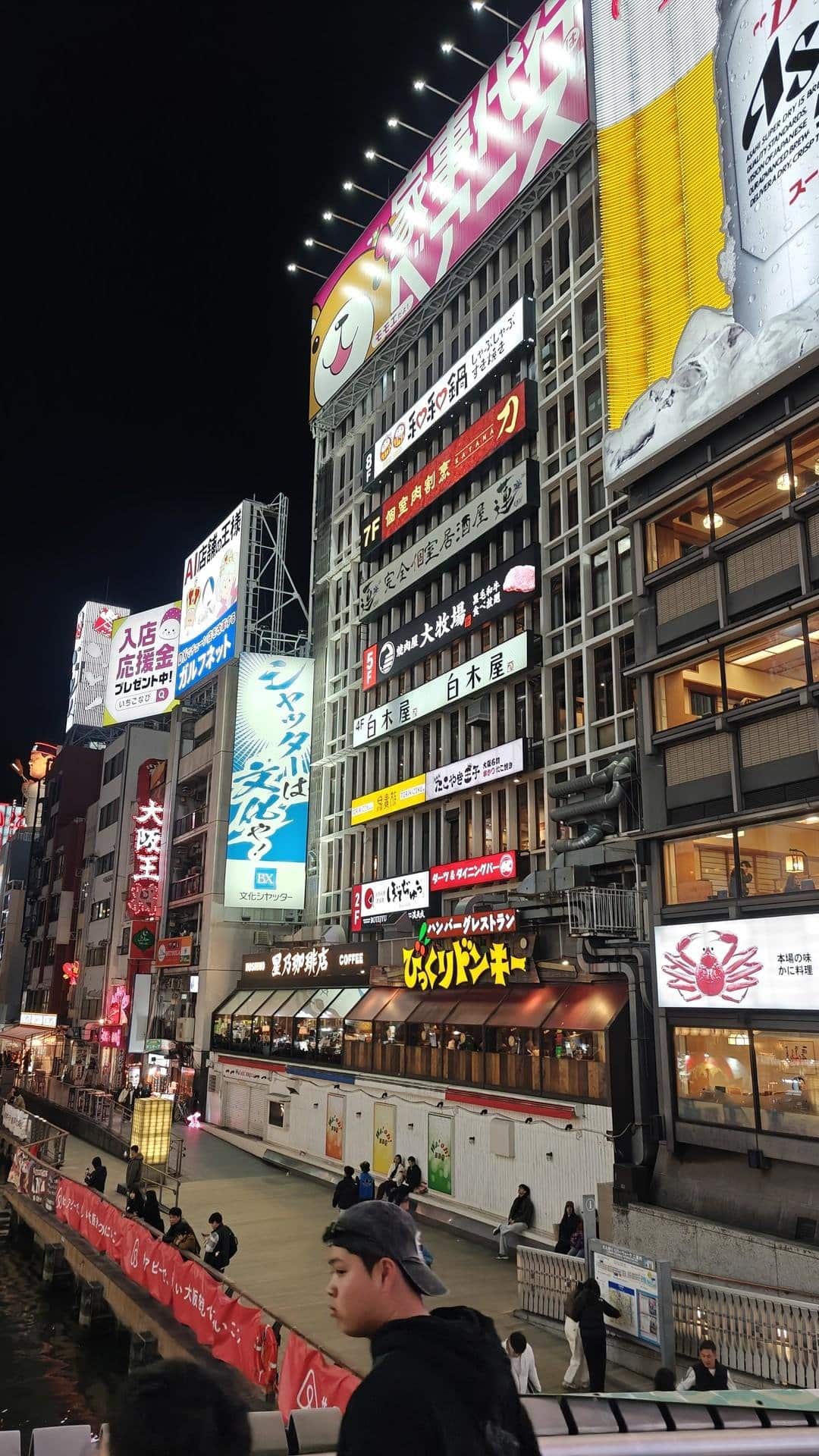 Vibrant city street with neon signs