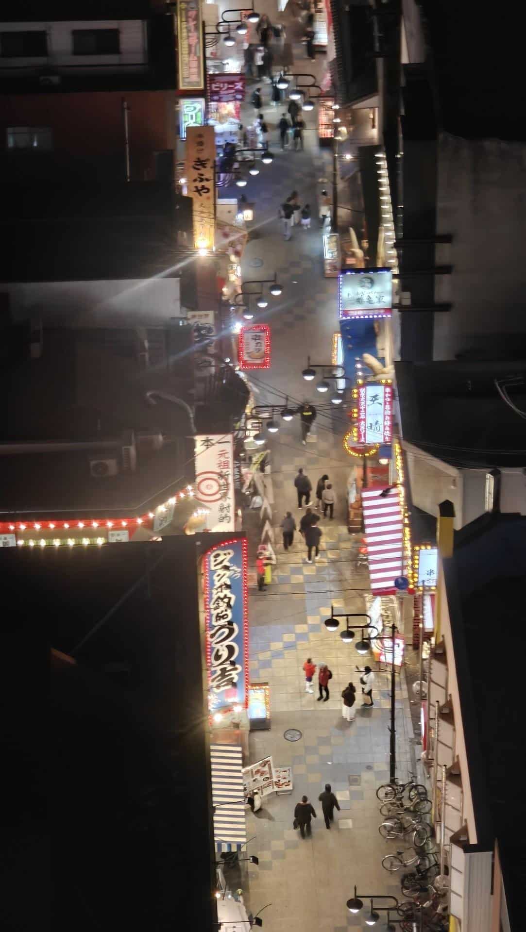 Vibrant street scene at night with lights