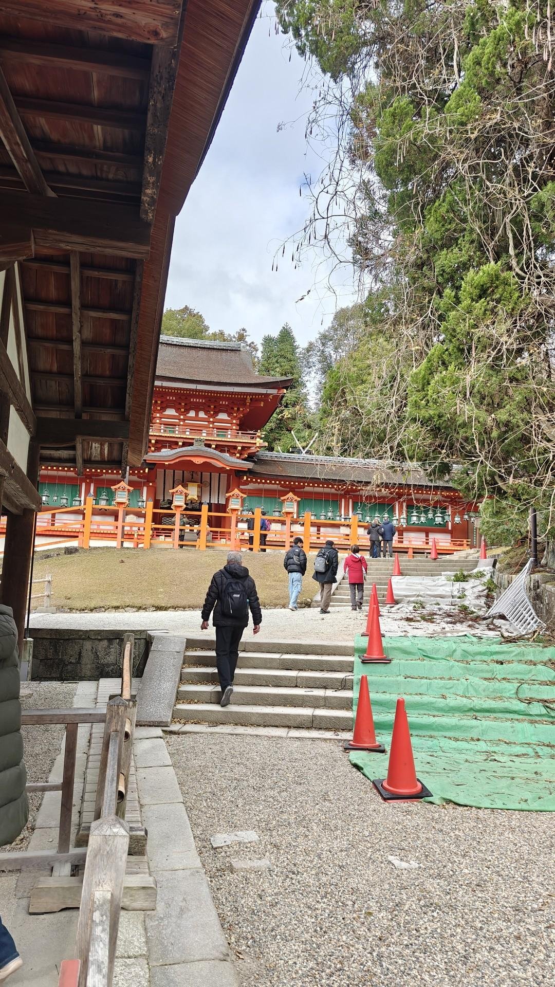 Visitors at traditional shrine entrance